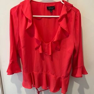 Pink blouse with ruffles